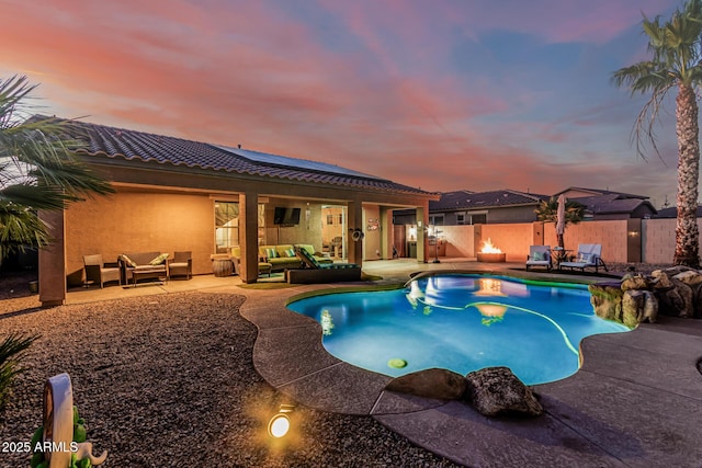 16077 W Anasazi St, Goodyear, AZ 85338 - view of pool featuring an outdoor living space, a patio, and a fenced backyard