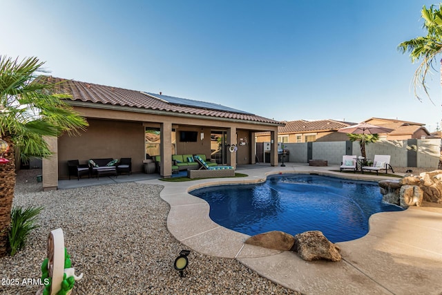 16077 W Anasazi St, Goodyear, AZ 85338 - view of pool featuring outdoor lounge area, a patio, a fenced backyard, and a grill