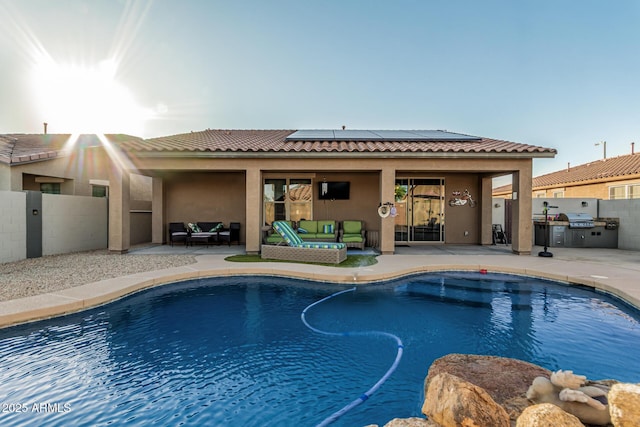16077 W Anasazi St, Goodyear, AZ 85338 - view of pool with outdoor lounge area, exterior kitchen, and a patio