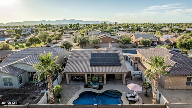 16077 W Anasazi St, Goodyear, AZ 85338 - aerial perspective of suburban area featuring a mountain backdrop and a pool area