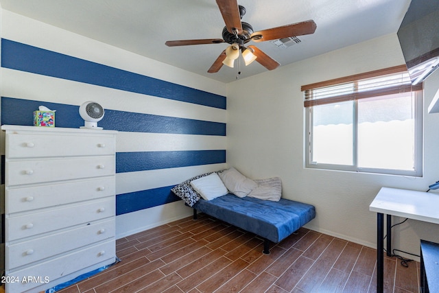 bedroom featuring ceiling fan and dark wood-type flooring