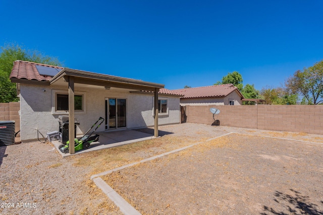 back of house with a patio and central AC unit