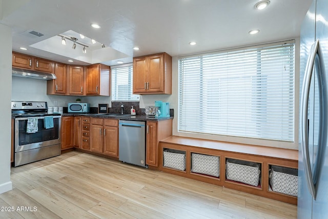 kitchen featuring light hardwood / wood-style floors, sink, and appliances with stainless steel finishes