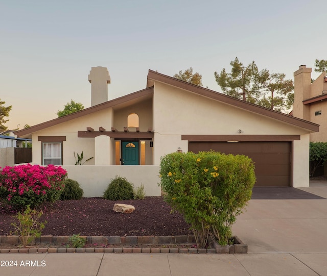 view of front of property with a garage