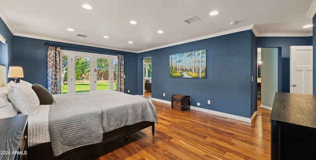 bedroom with french doors, crown molding, hardwood / wood-style floors, and access to outside