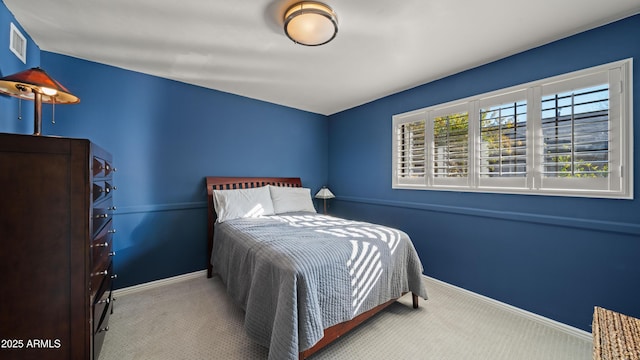 bedroom with light carpet