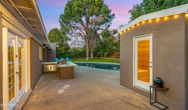 patio terrace at dusk with french doors