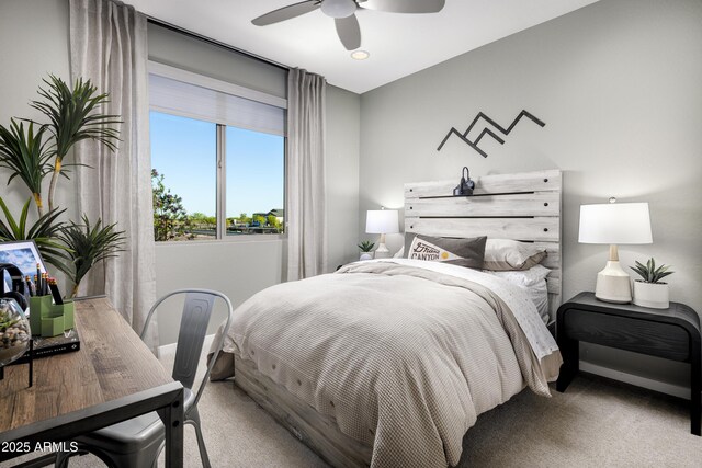 carpeted bedroom featuring a ceiling fan and baseboards