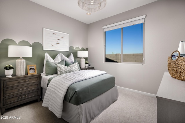 bedroom featuring carpet flooring and baseboards