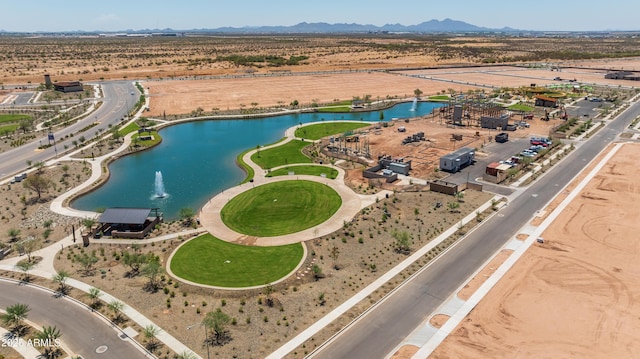 aerial view of property's location featuring a water and mountain view