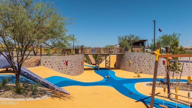 view of play area featuring fence