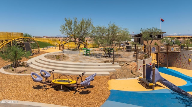 view of home's community with fence and a patio area