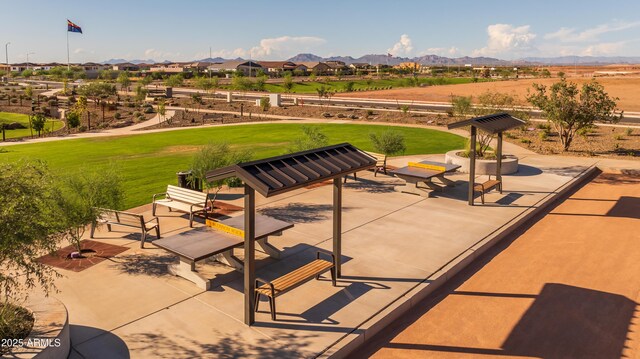 view of patio / terrace with a mountain view and a residential view