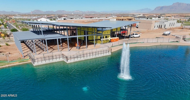 view of pool with a water and mountain view and a residential view