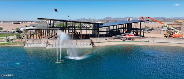 view of pool with a water and mountain view