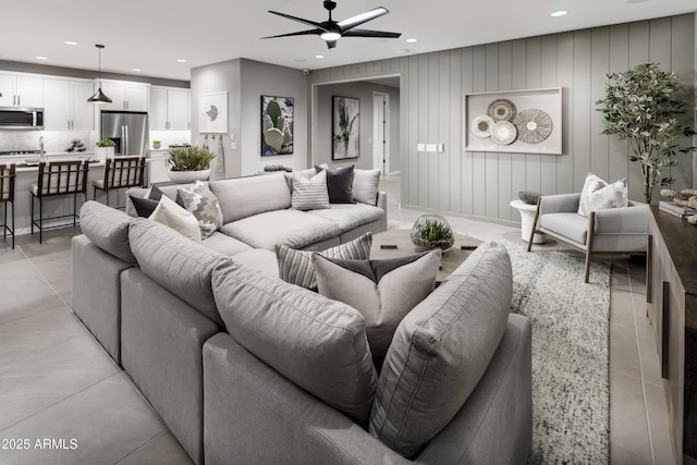 living room featuring recessed lighting, ceiling fan, and light tile patterned flooring