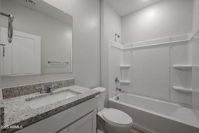 full bathroom with shower / washtub combination, toilet, and vanity