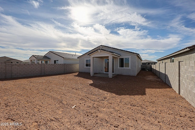 back of property with a patio area