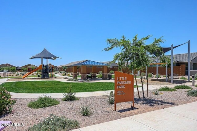 view of community with a playground and a lawn