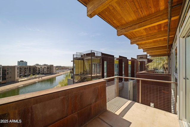 balcony featuring a water view