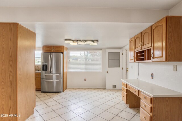 2001 Golf Links Rd, Sierra Vista, AZ 85635 - kitchen featuring stainless steel refrigerator with ice dispenser, light countertops, light tile patterned floors, open shelves, and baseboards