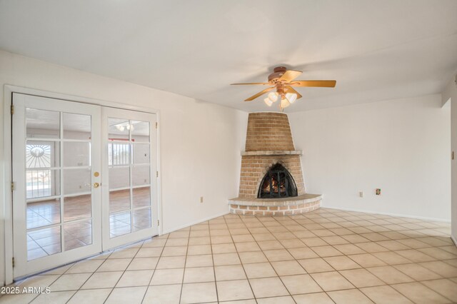 2001 Golf Links Rd, Sierra Vista, AZ 85635 - unfurnished living room featuring ceiling fan, a brick fireplace, french doors, and baseboards