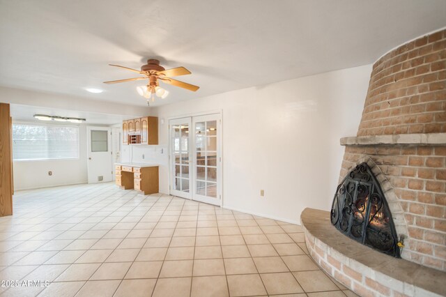 2001 Golf Links Rd, Sierra Vista, AZ 85635 - unfurnished living room with ceiling fan, a fireplace, light tile patterned floors, and baseboards