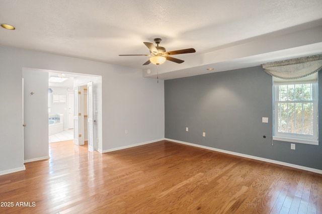 2001 Golf Links Rd, Sierra Vista, AZ 85635 - empty room with ceiling fan, light wood finished floors, and baseboards
