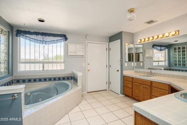 2001 Golf Links Rd, Sierra Vista, AZ 85635 - full bathroom featuring a jetted tub, vanity, and tile patterned flooring