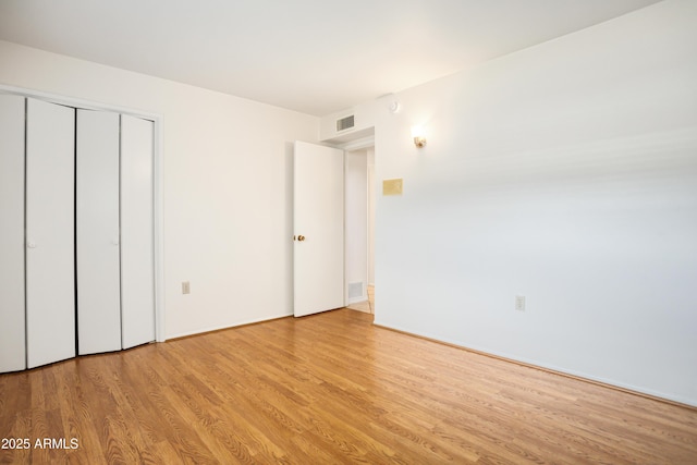 2001 Golf Links Rd, Sierra Vista, AZ 85635 - unfurnished bedroom featuring wood finished floors and a closet