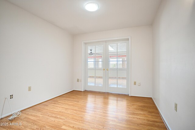 2001 Golf Links Rd, Sierra Vista, AZ 85635 - empty room with light wood-style floors, french doors, and baseboards