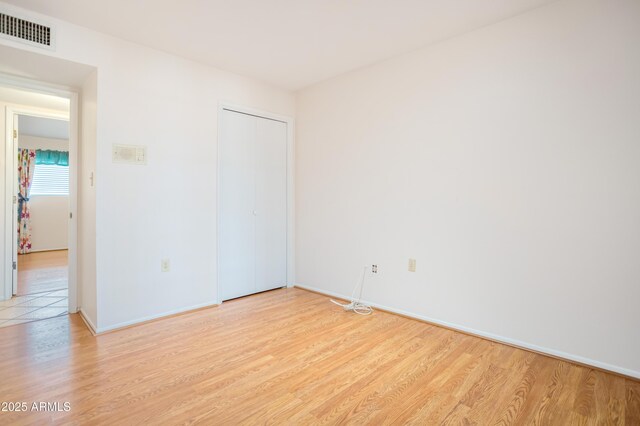 2001 Golf Links Rd, Sierra Vista, AZ 85635 - unfurnished bedroom featuring light wood-style floors, baseboards, and a closet