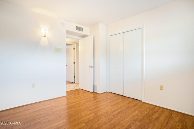 2001 Golf Links Rd, Sierra Vista, AZ 85635 - unfurnished bedroom with wood finished floors, a closet, and baseboards