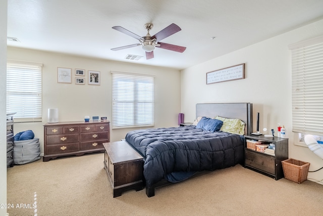 bedroom featuring ceiling fan and light colored carpet