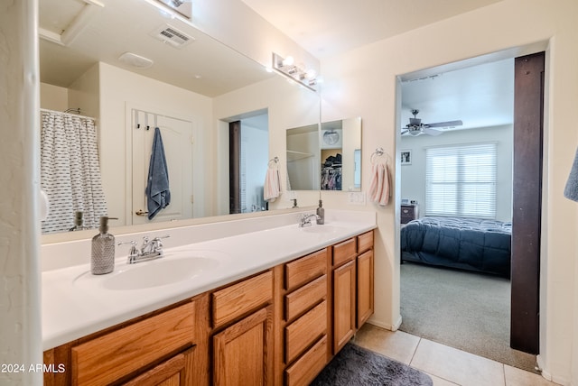 bathroom featuring vanity, ceiling fan, and tile patterned flooring