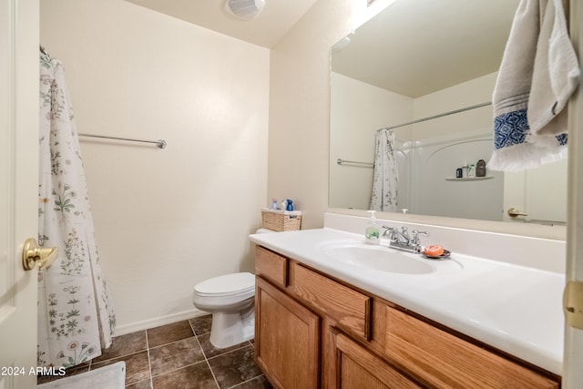 bathroom with curtained shower, tile patterned flooring, vanity, and toilet