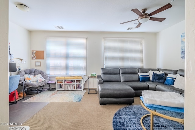 living room featuring carpet and ceiling fan