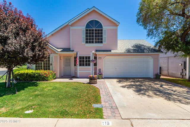 front of property with a garage and a front lawn