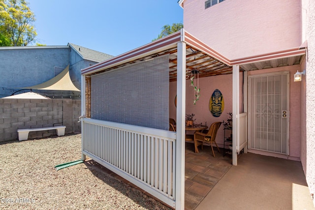 view of property exterior with a patio area