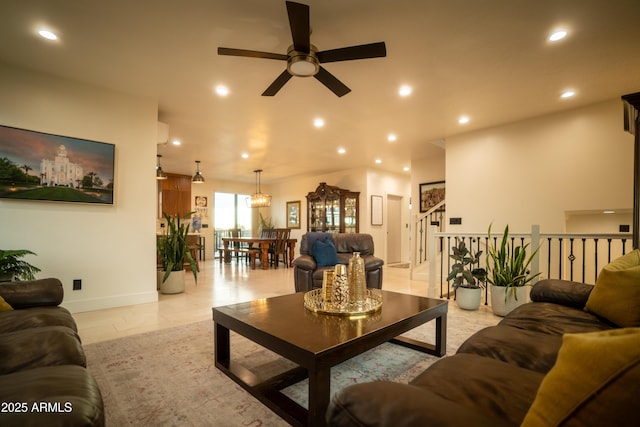 living area featuring recessed lighting, baseboards, and a ceiling fan