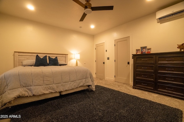 bedroom featuring ceiling fan, recessed lighting, light colored carpet, and a wall mounted AC