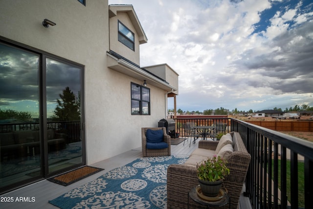 balcony with outdoor dining area and area for grilling