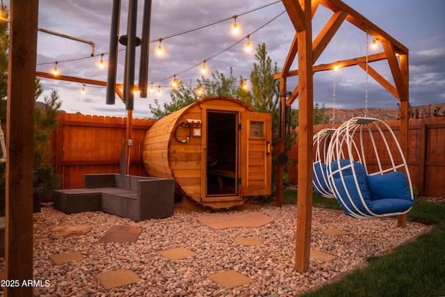 exterior space with an outdoor structure and a fenced backyard