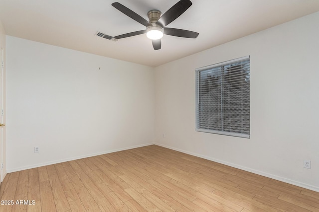 unfurnished room featuring visible vents, baseboards, light wood-style floors, and a ceiling fan