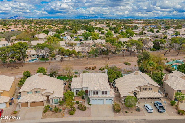 birds eye view of property featuring a mountain view and a residential view