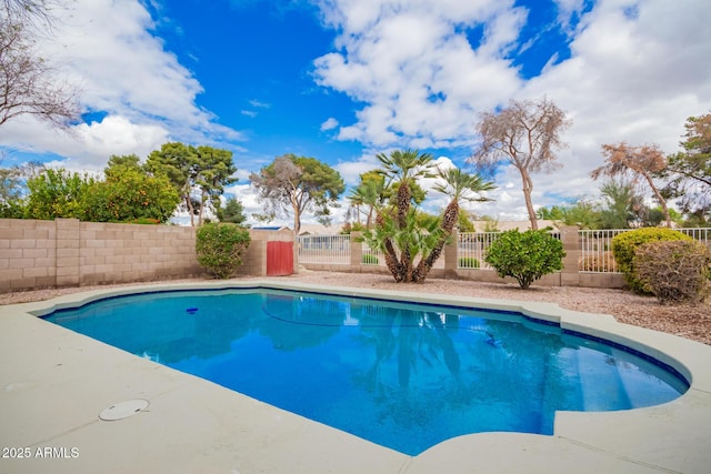 view of swimming pool with a fenced in pool and a fenced backyard