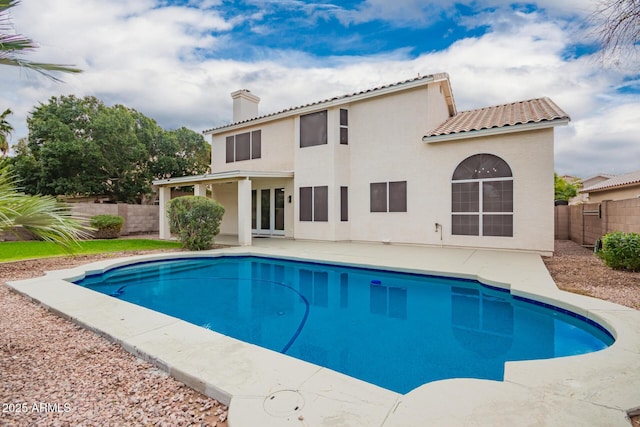 view of pool with a fenced in pool, a fenced backyard, and a patio area