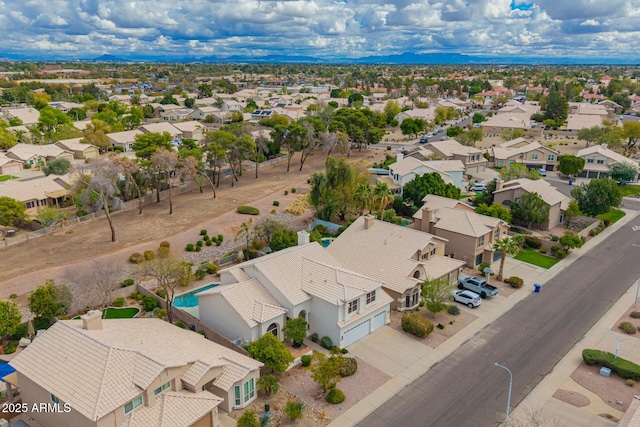 birds eye view of property with a residential view