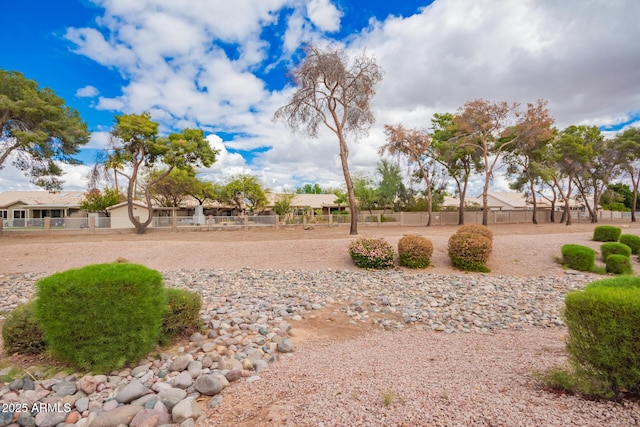 view of property's community with fence