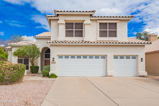 mediterranean / spanish-style house with a garage, a tile roof, concrete driveway, and stucco siding